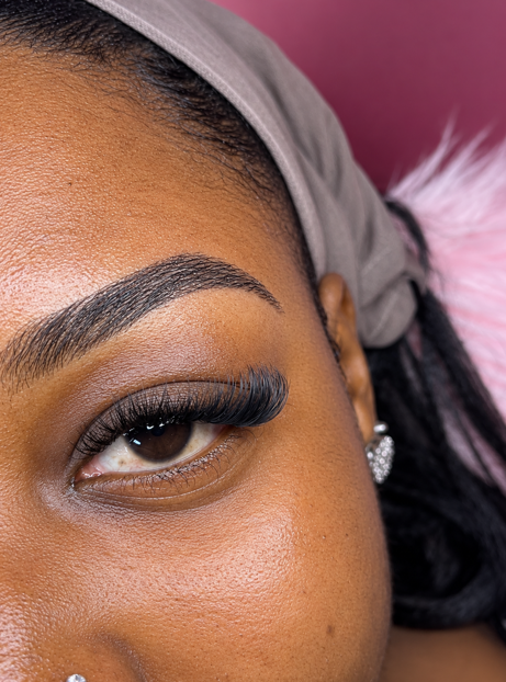 Defined brows and a natural lash set, close-up